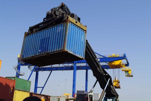 car being loaded onto an international ocean vessel