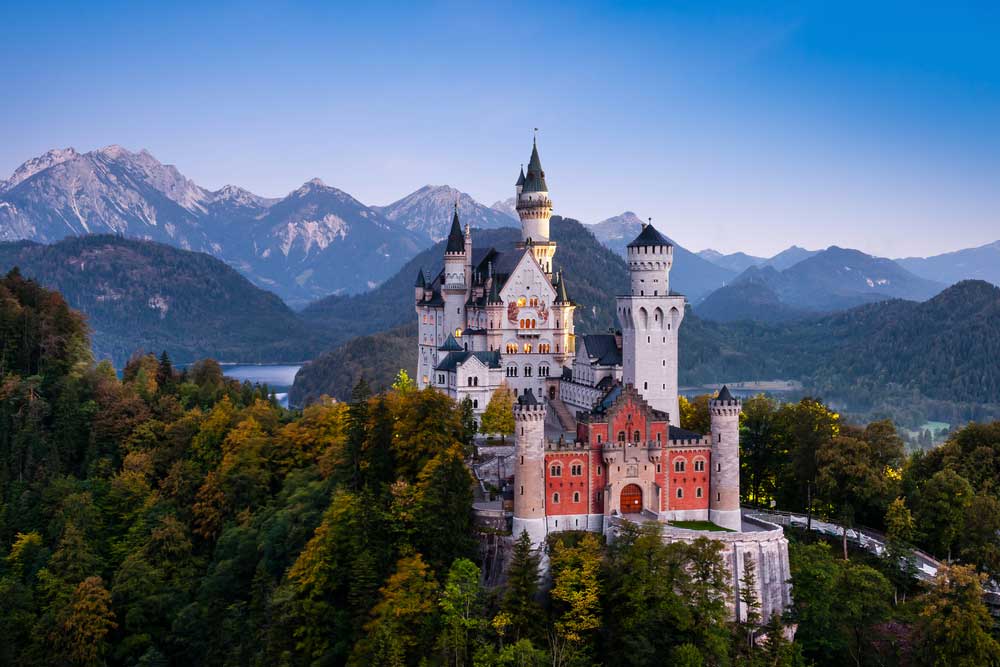 amazing shot of a castle in the mountains somewhere in germany